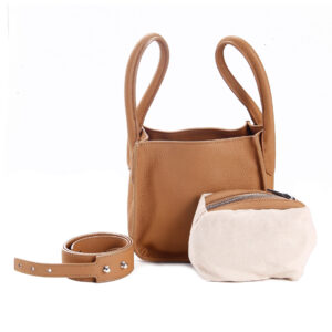 Women's mustard leather structured sling bag with a sleek finish, adjustable strap, and spacious interior for your essentials on the go.